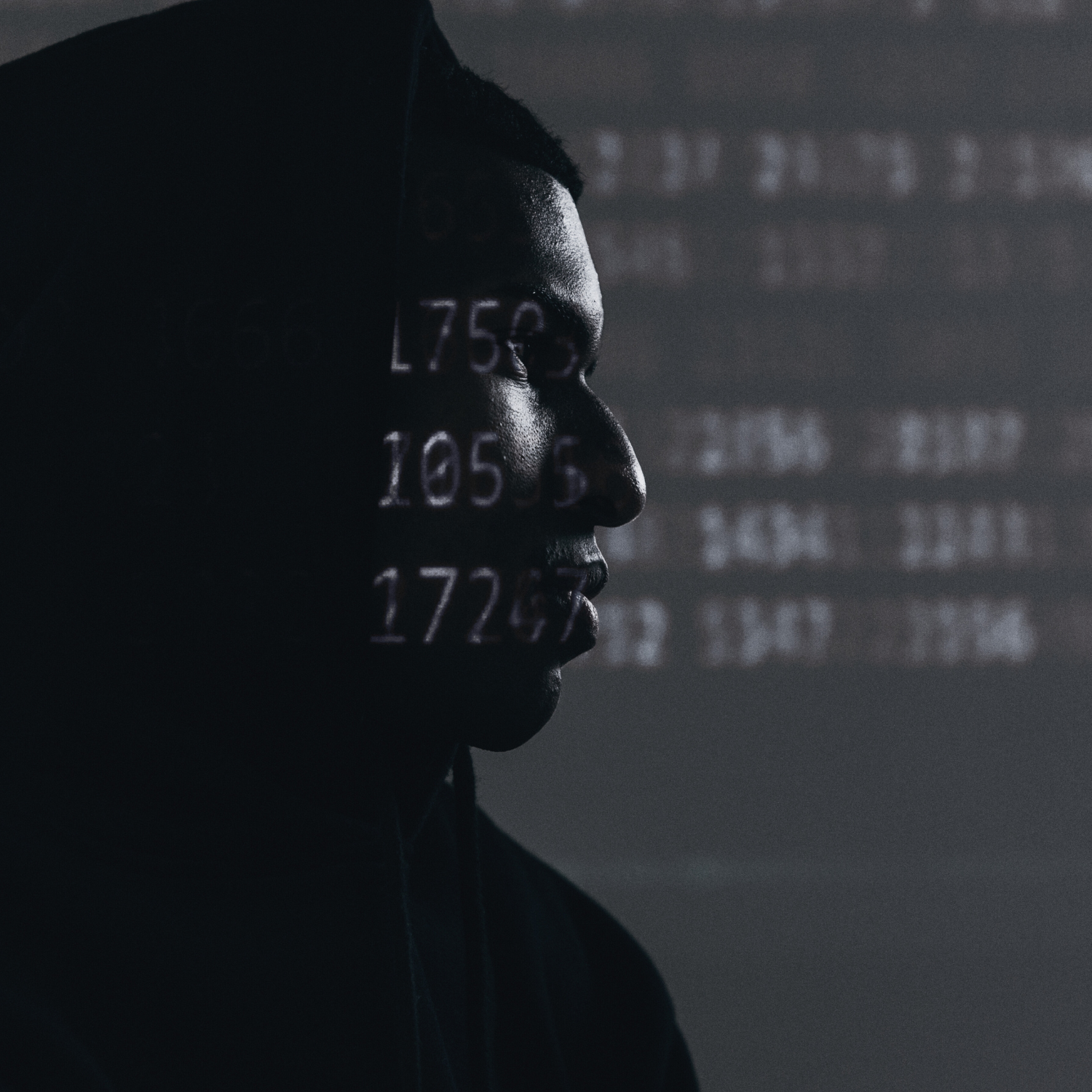 Hacker profile with code overlay